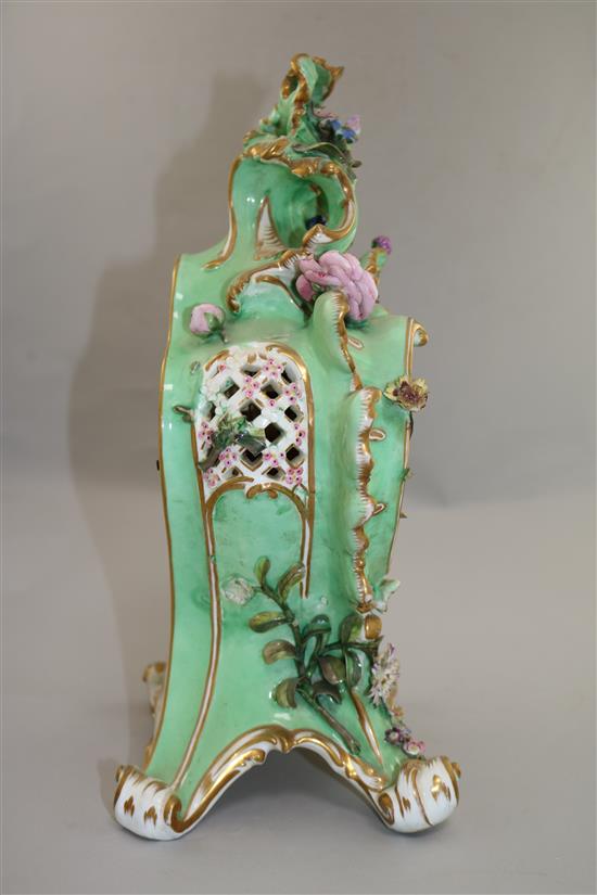 A Coalport floral encrusted mantel clock, with matching plinth, c.1830-5 17in.